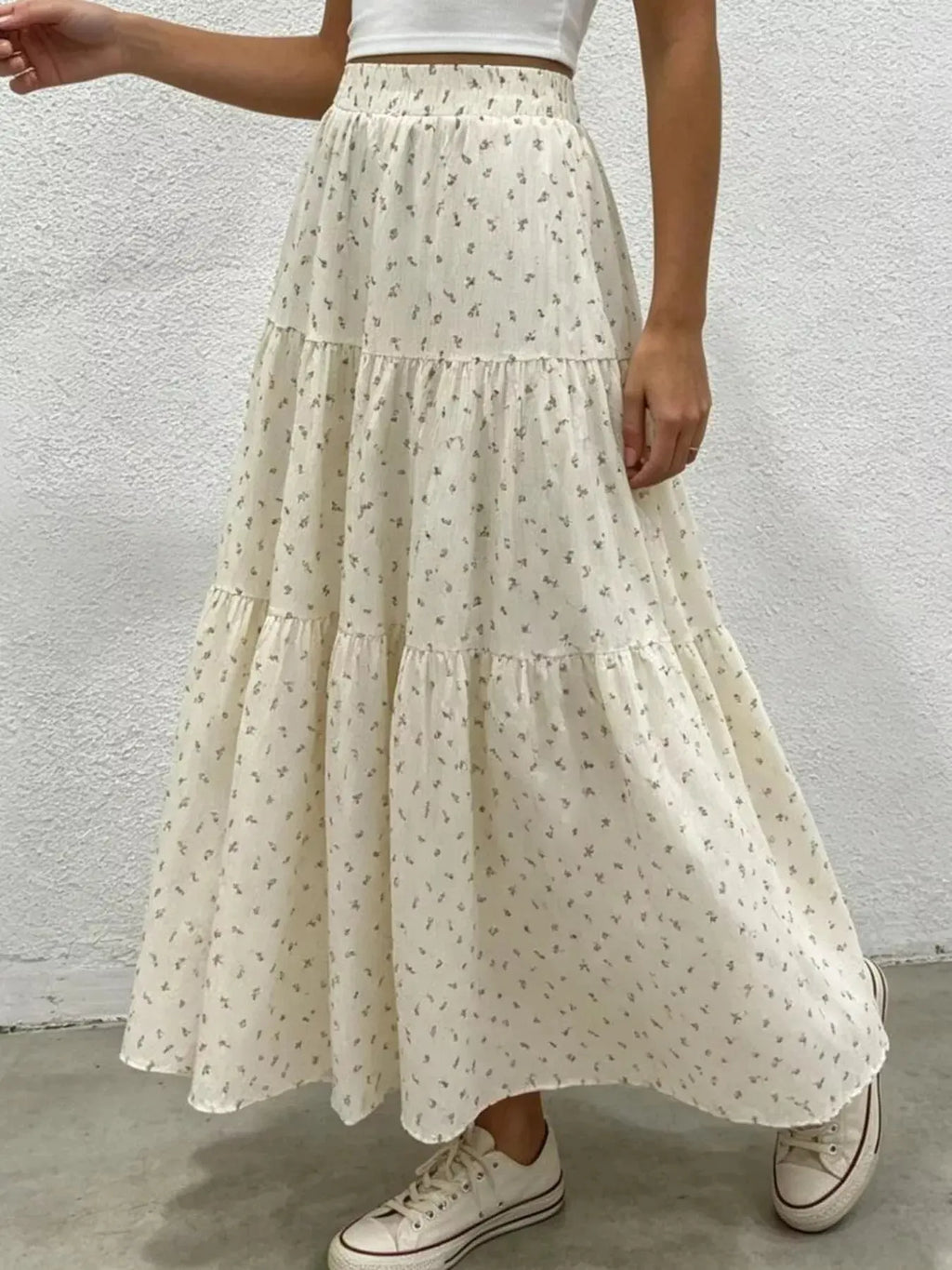 Floral print tiered maxi skirt styled on model