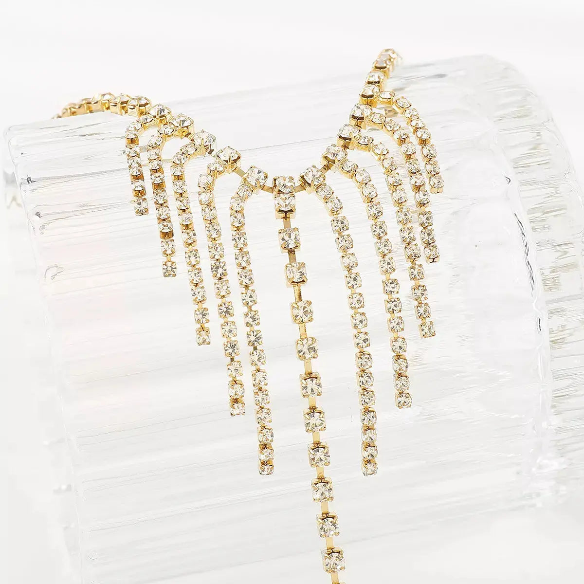 Woman wearing rhinestone fringe hand chain bracelet