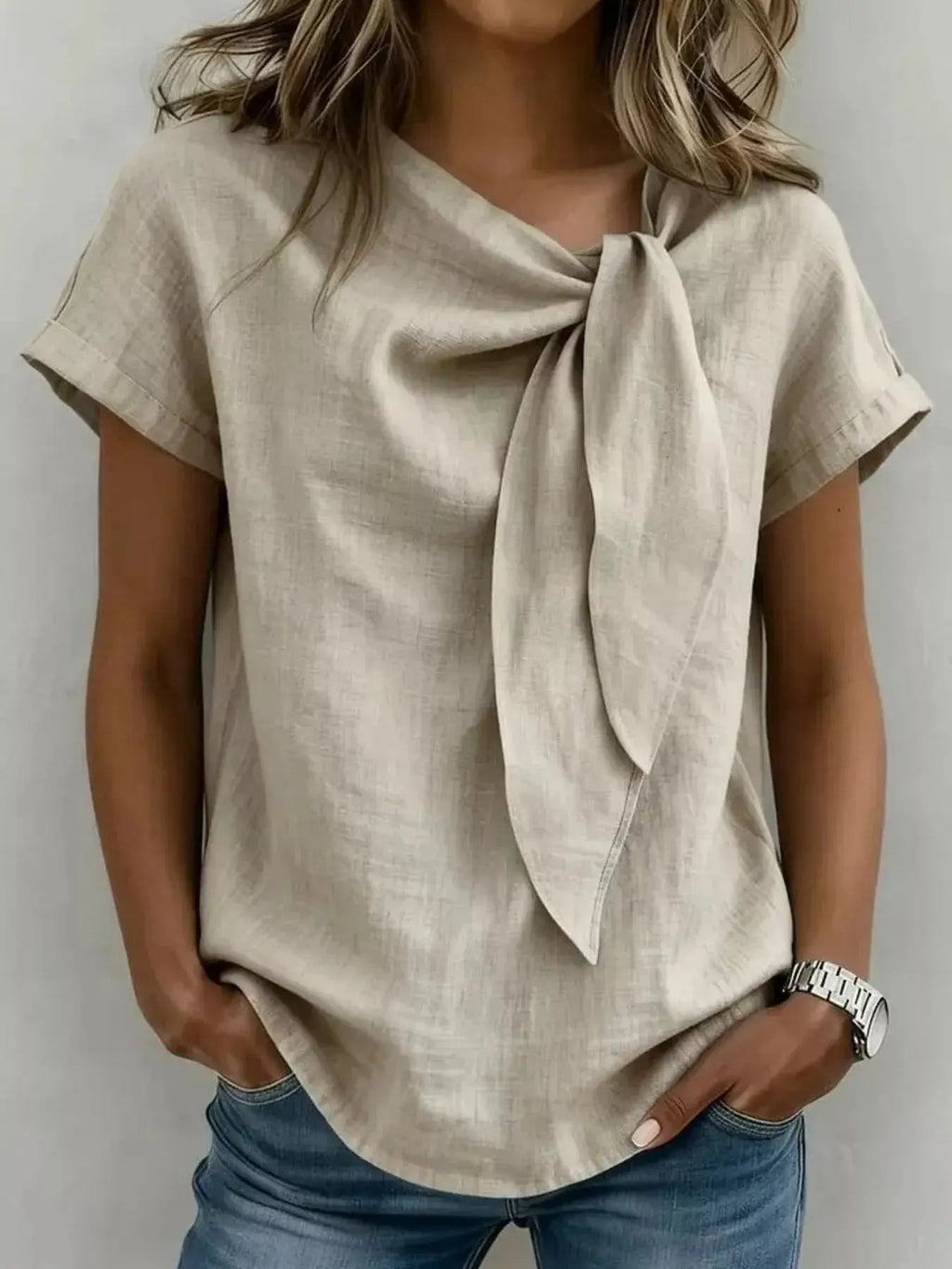 Woman wearing a plus-size bow tie neck short sleeve blouse from Vicsxox