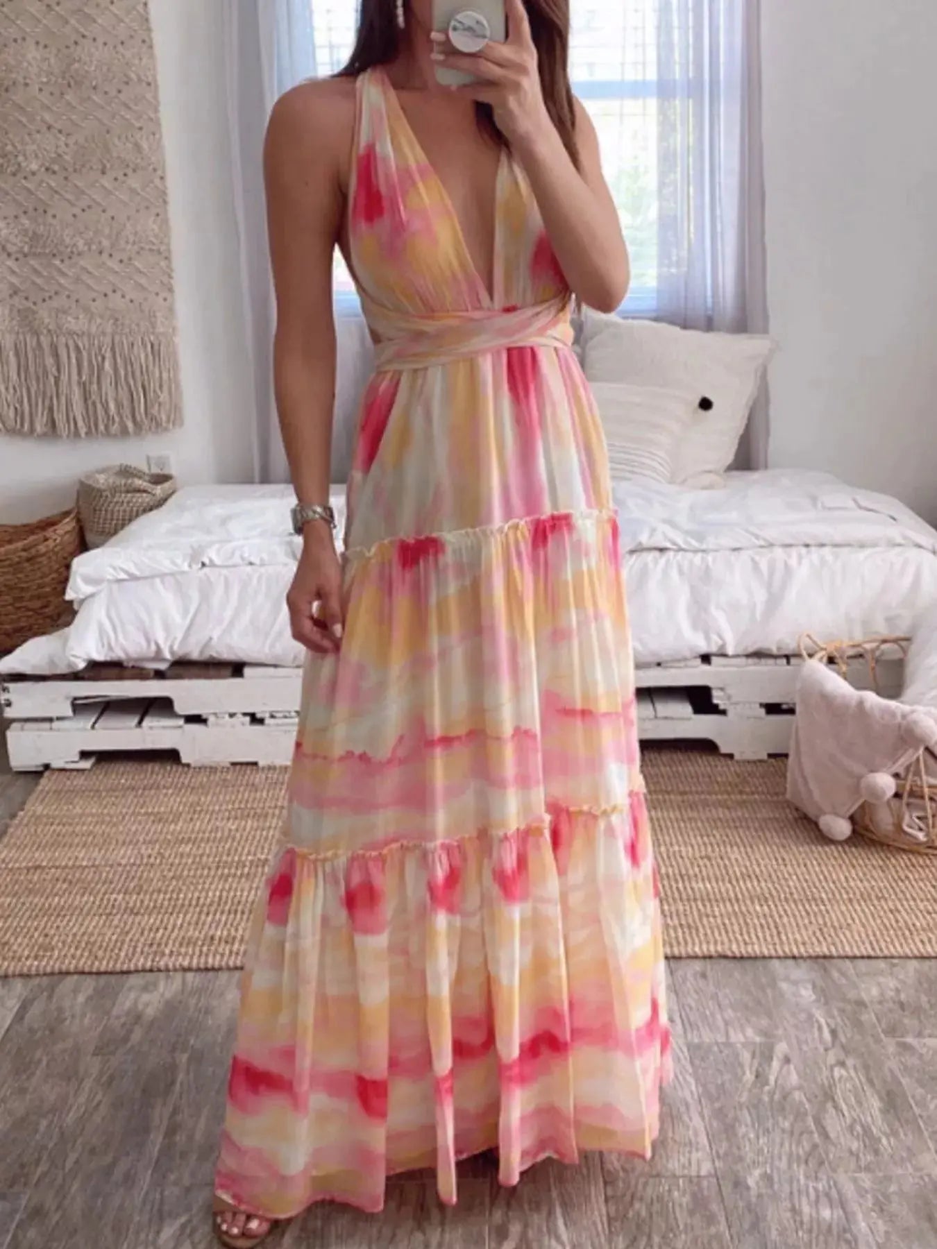 Woman wearing a tie-dye tiered maxi dress from Vicsxox
