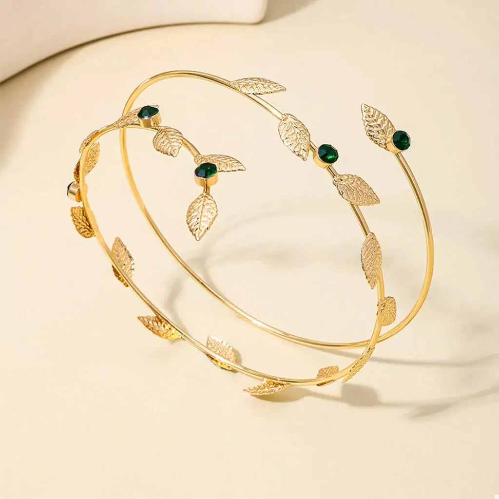 Woman wearing gold rhinestone leaf bracelet