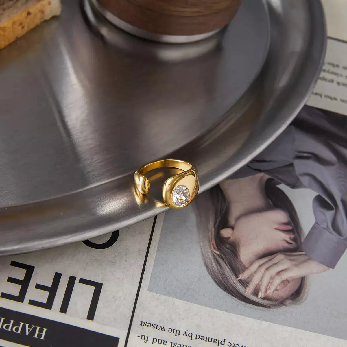 Close-up of rhinestone detail on gold open ring
