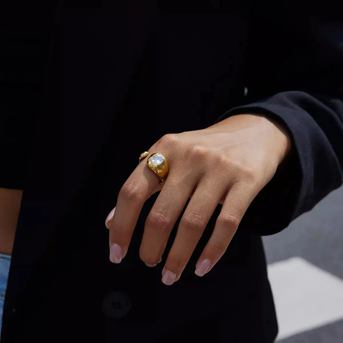 Woman wearing gold rhinestone open ring
