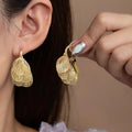 18K gold-plated textured leaf drop earrings from Vicsxox