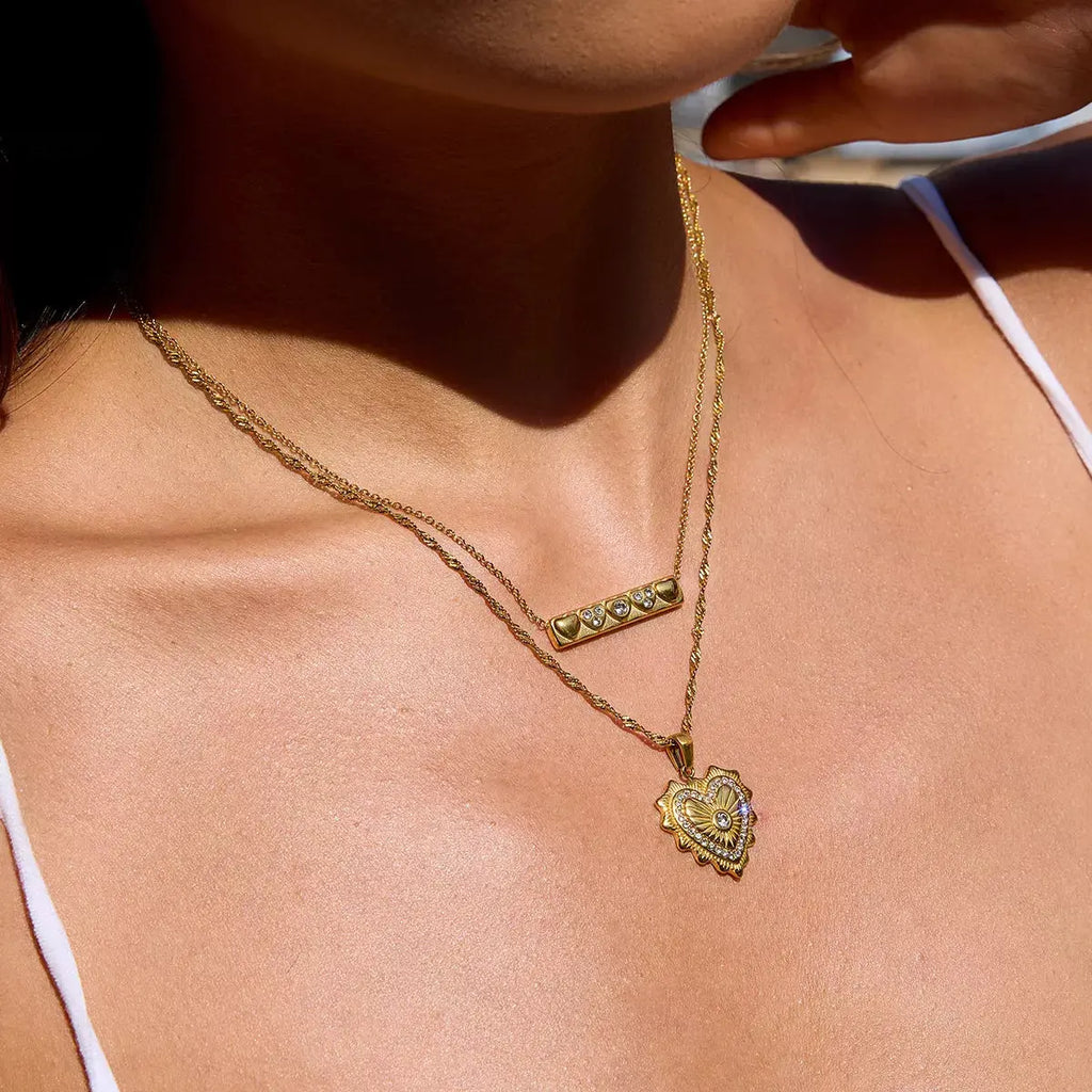 Close-up of zircon pendant on gold necklace