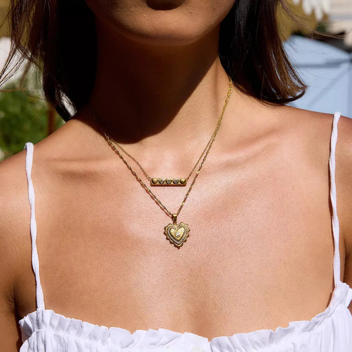 Woman wearing gold zircon pendant necklace