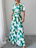 Woman wearing a printed wide leg belted jumpsuit from Vicsxox