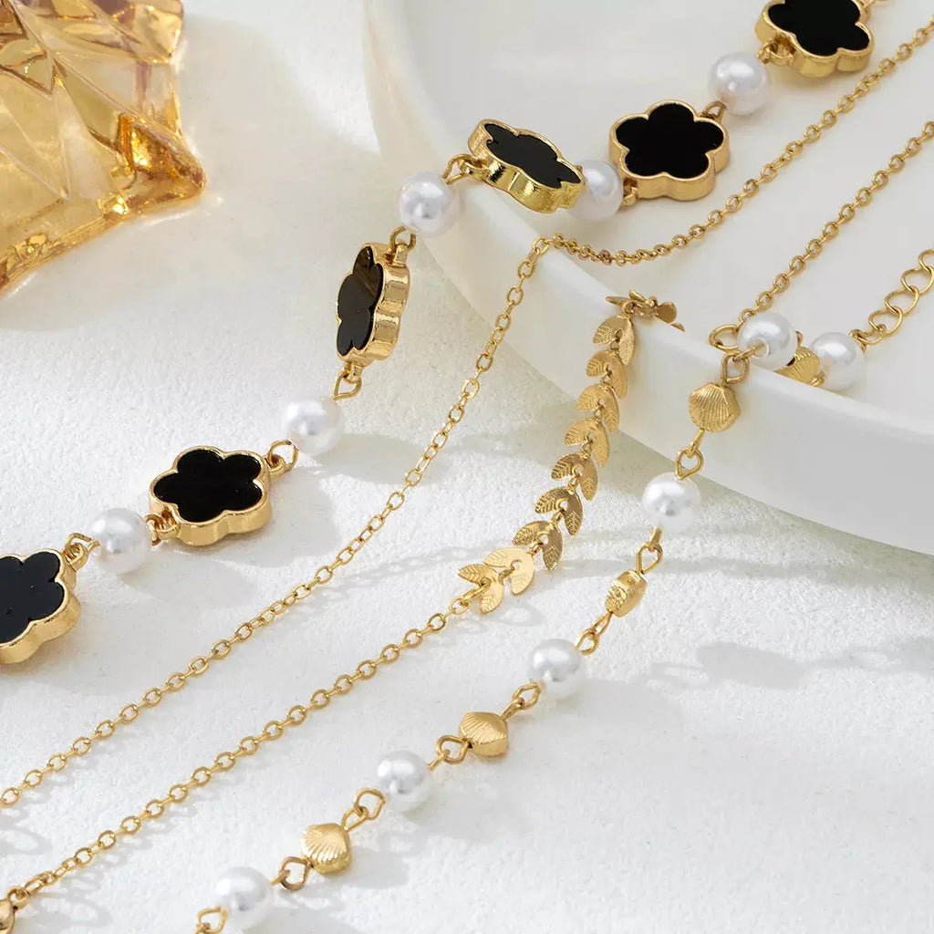 Close-up of resin accents on gold bracelet set