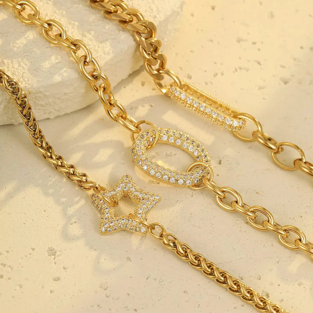 Close-up of rhinestone detail on gold chain bracelet
