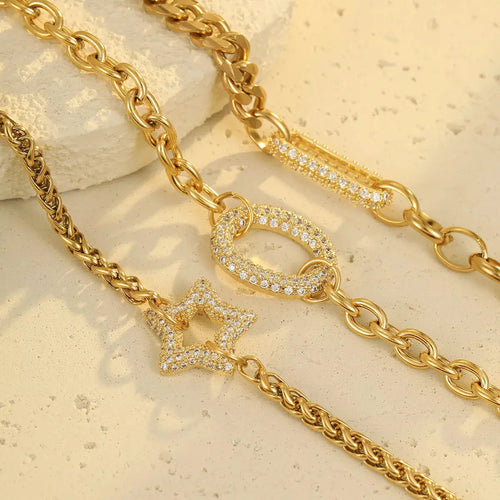 Close-up of rhinestone detail on gold chain bracelet