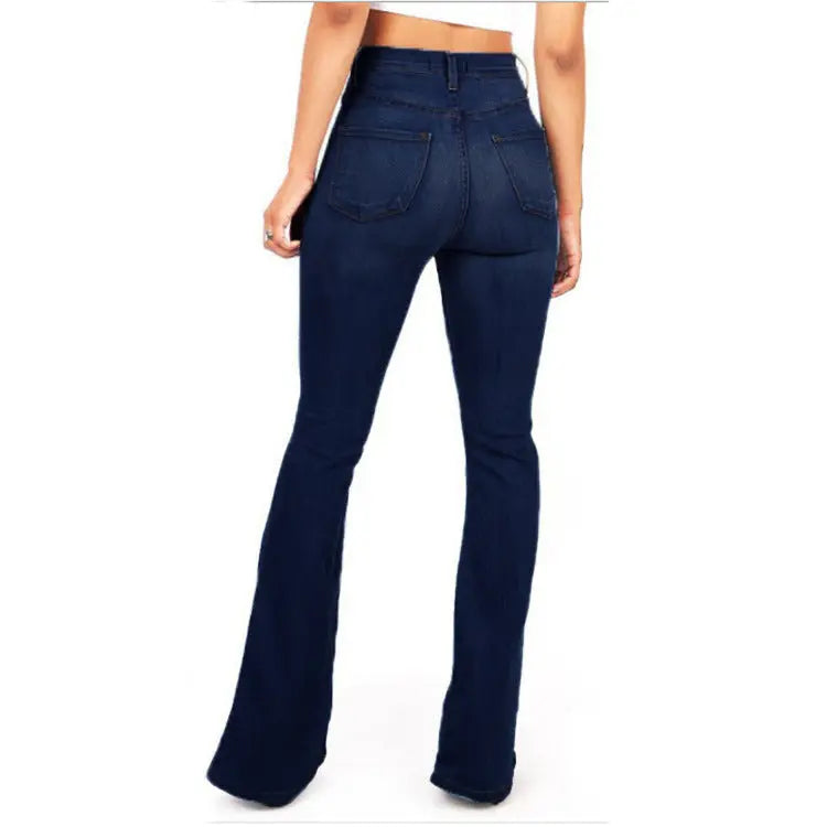 Navy blue flared jeans worn by a person on a white background