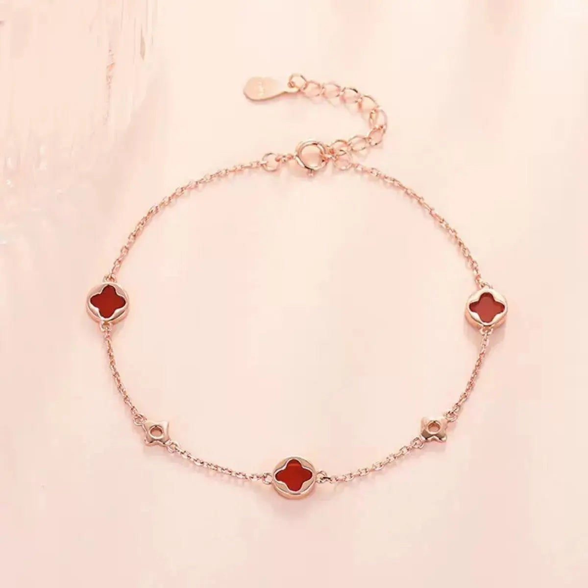 Woman wearing rose gold four leaf clover bracelet