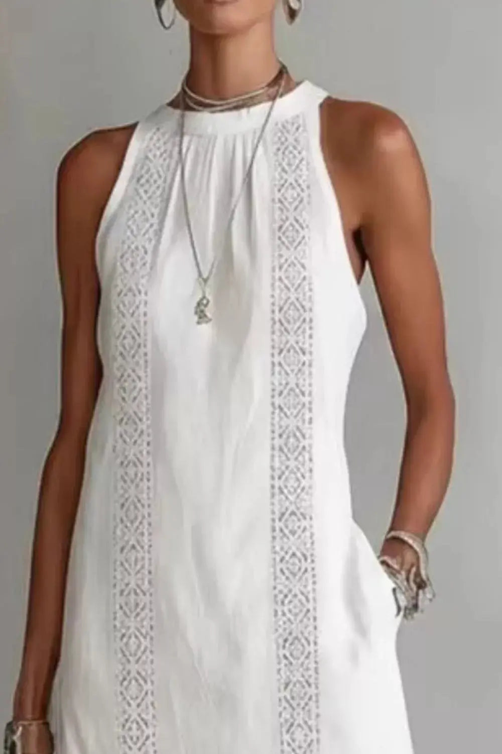 Close-up of side slit detail on sleeveless dress