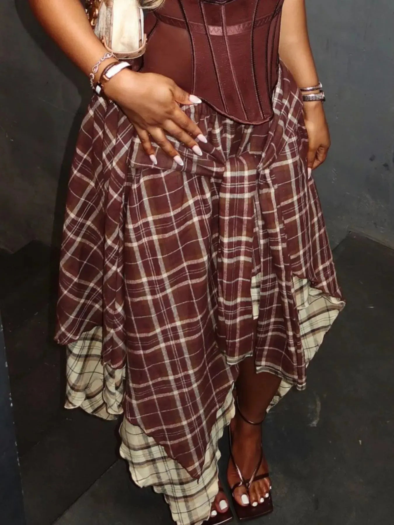 Asymmetrical plaid skirt styled on model