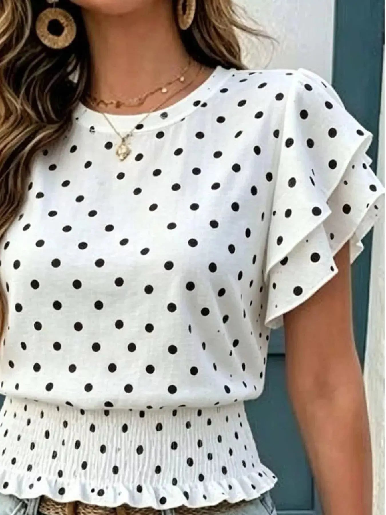 Side view of smocked polka dot blouse