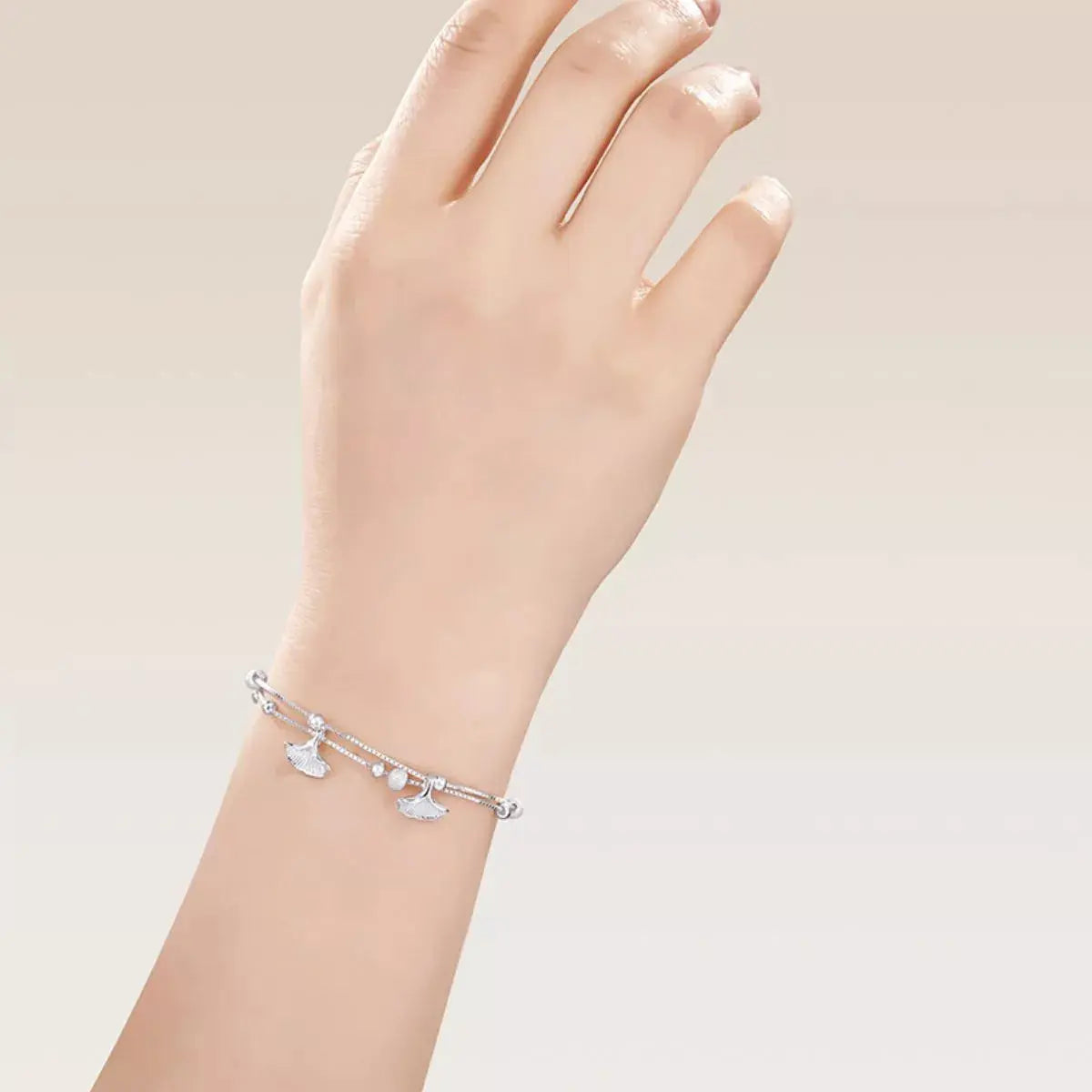 Woman wearing double layer ginkgo leaf bracelet