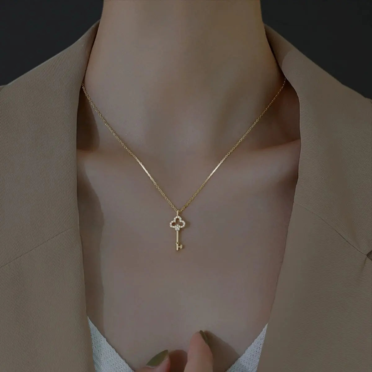 Close-up of key pendant with zircon accents