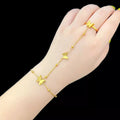 Woman wearing butterfly charm finger bracelet