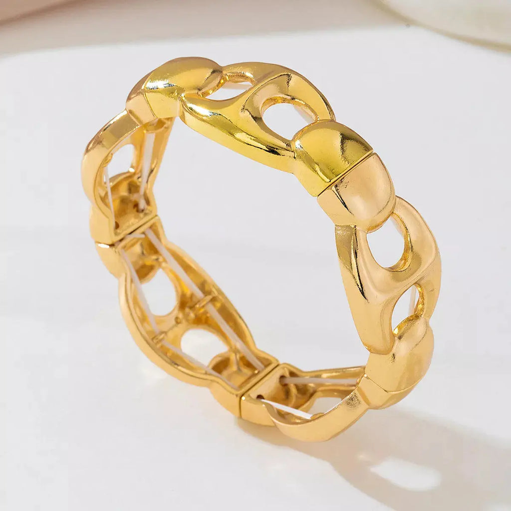 Close-up of chain link detail on gold bracelet