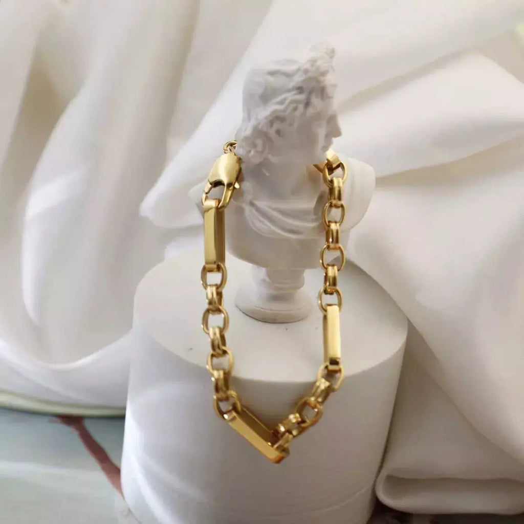 Woman wearing chunky gold chain link bracelet