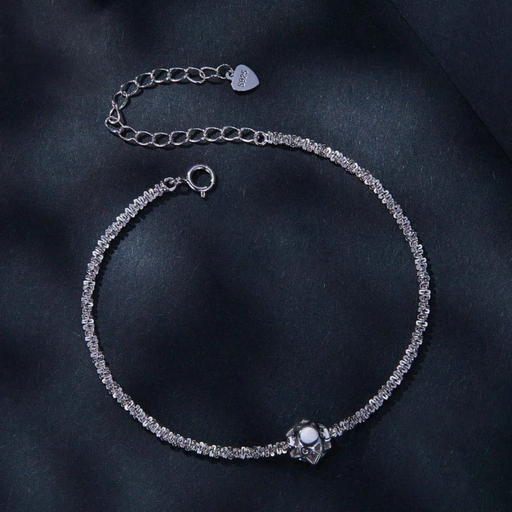 Close-up of zircon detail on silver bracelet