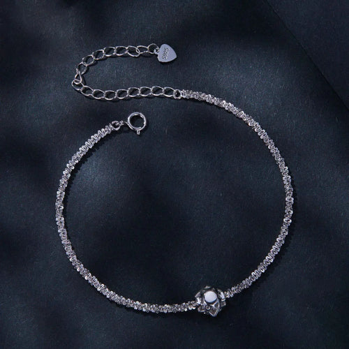 Close-up of zircon detail on silver bracelet