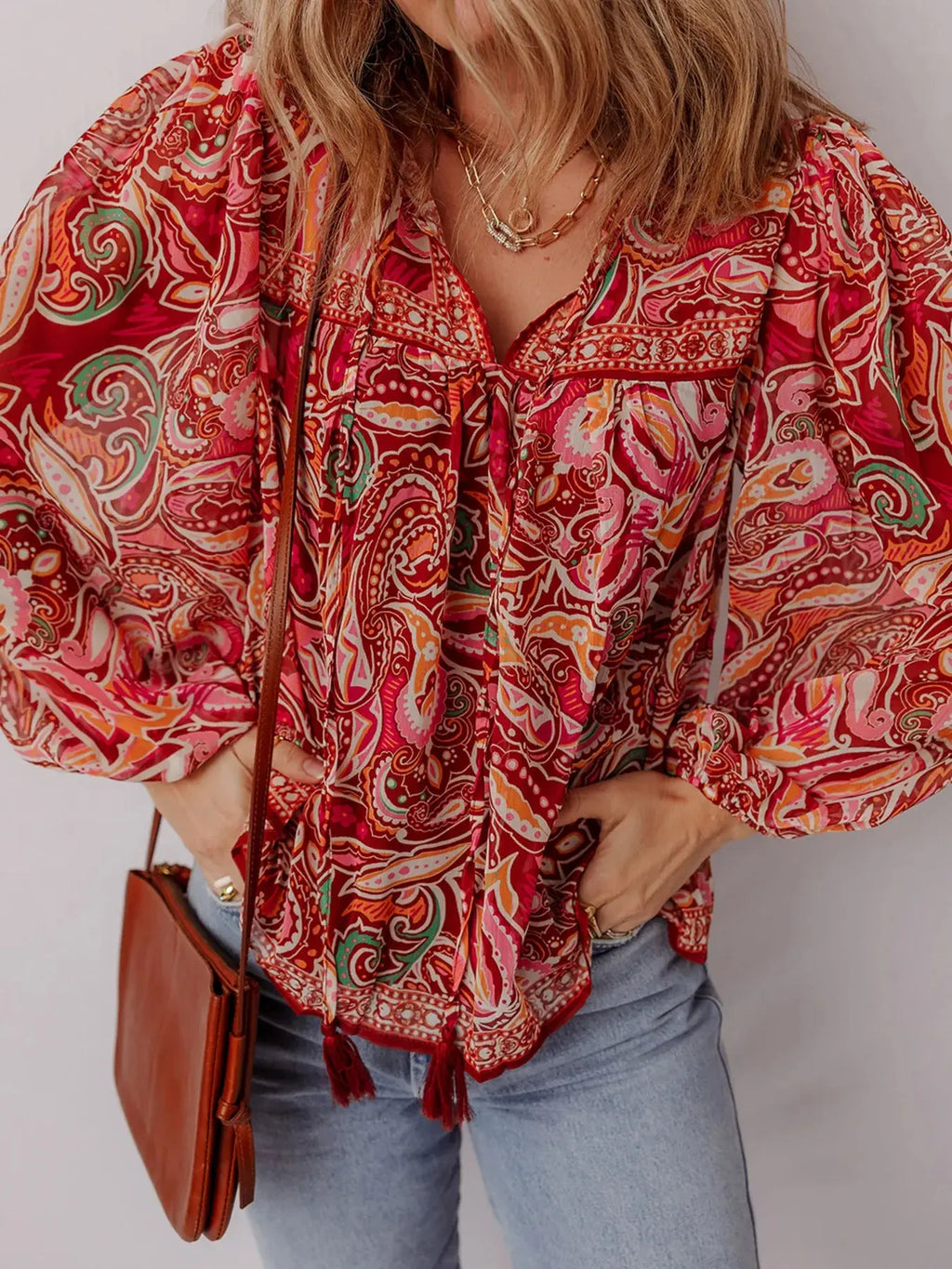 Side view of puff sleeve paisley print blouse