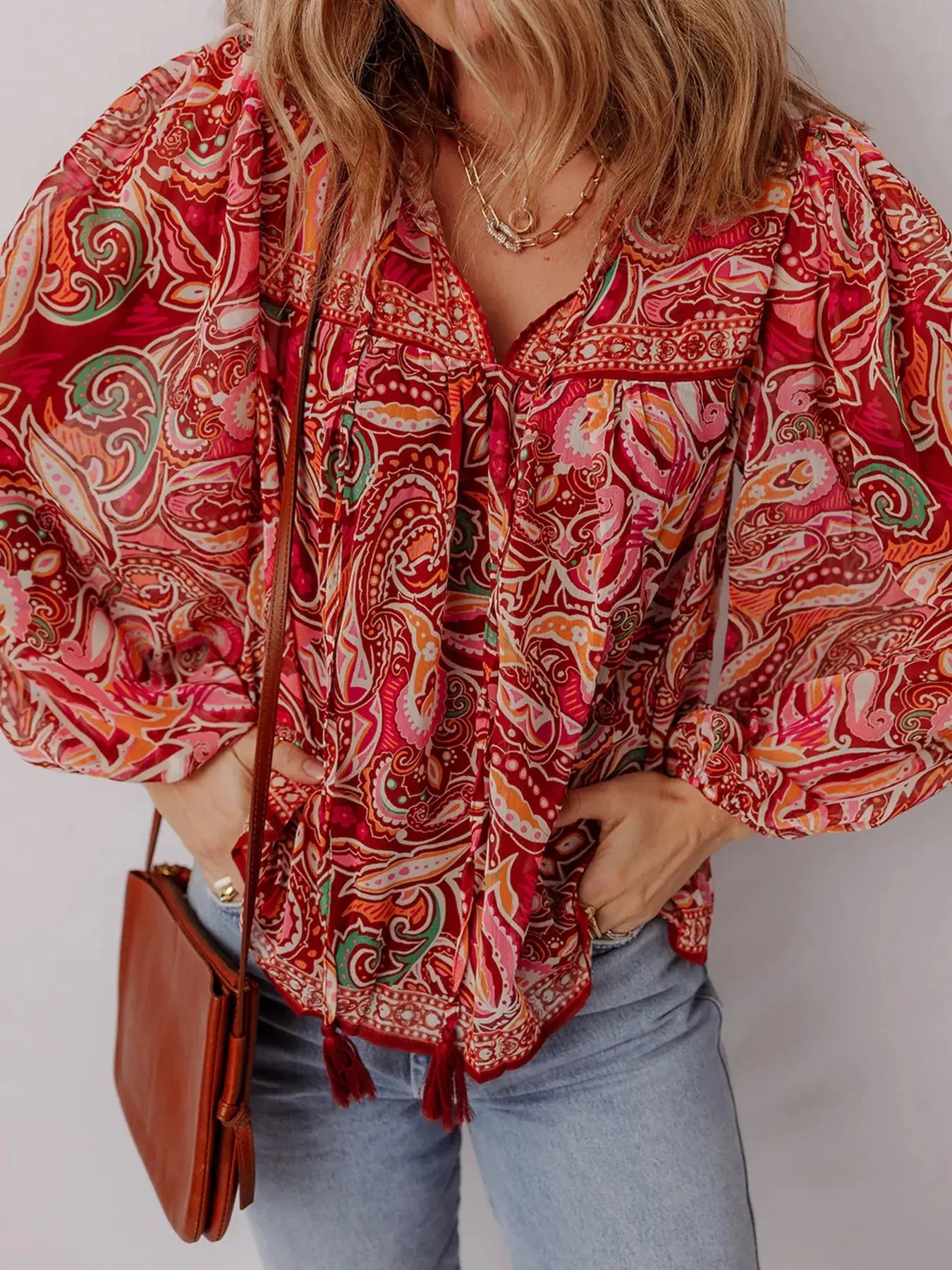Side view of puff sleeve paisley print blouse