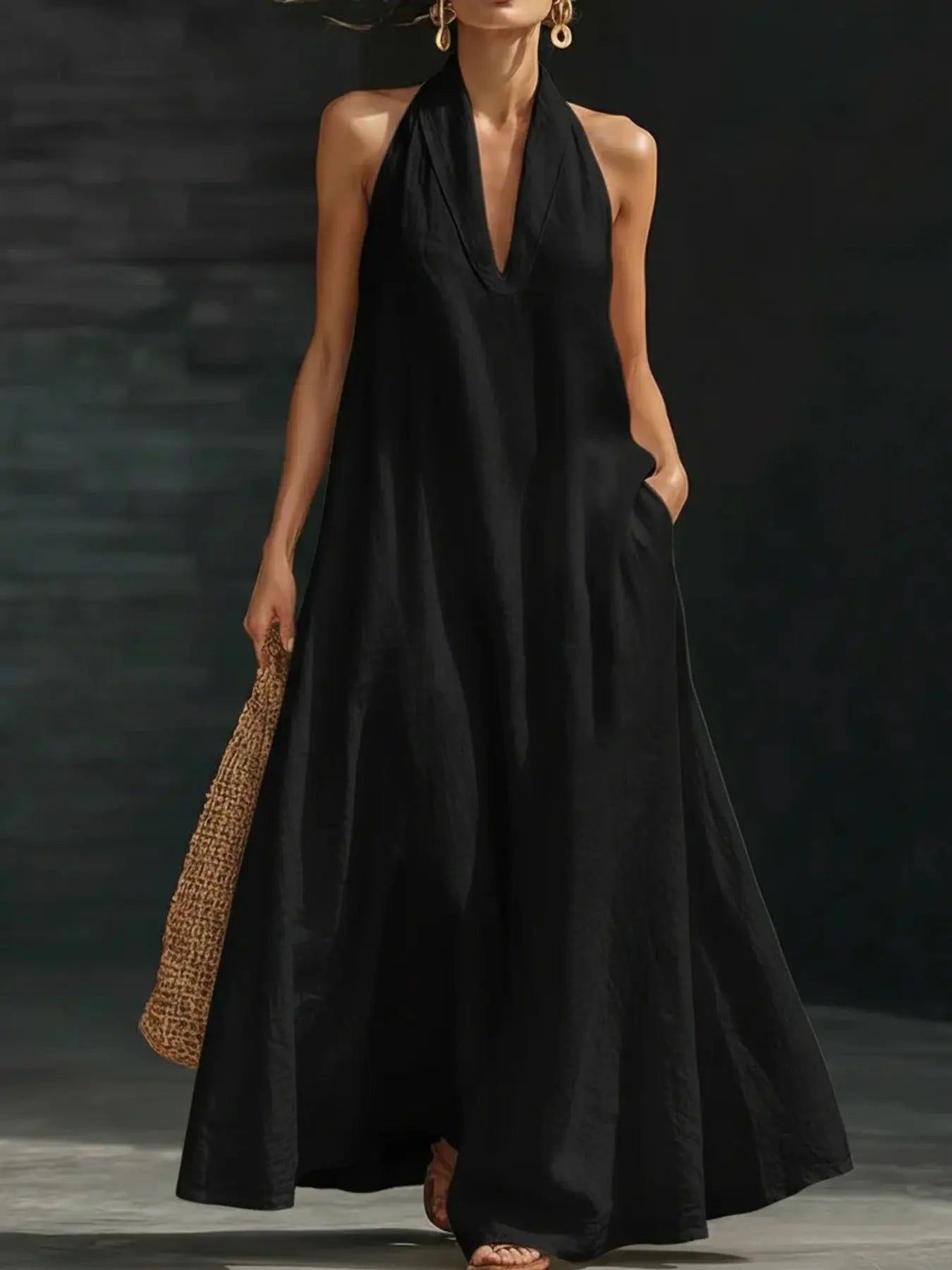 Woman wearing a halter neck maxi dress with pockets from Vicsxox
