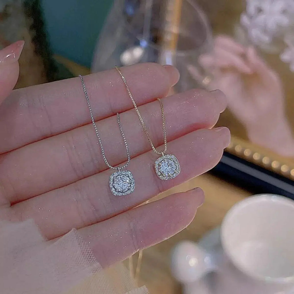 Close-up of zircon pendant on silver necklace