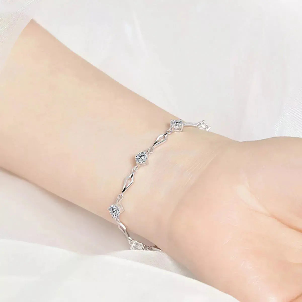 Woman wearing silver zircon bracelet