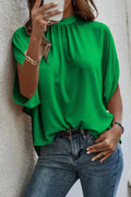 Woman wearing a tie back slit half sleeve blouse from Vicsxox