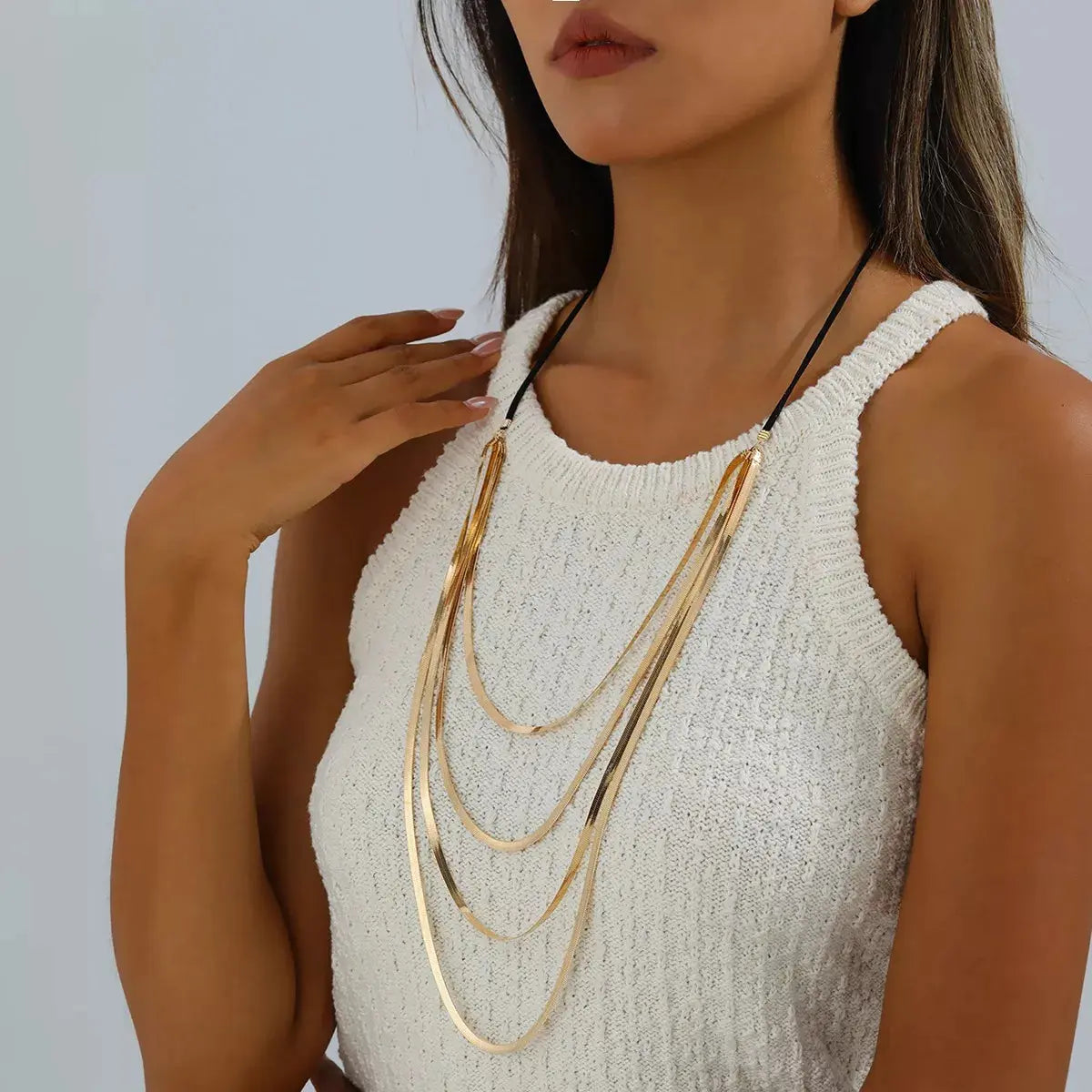 Multi-layered snake chain necklace styled on model