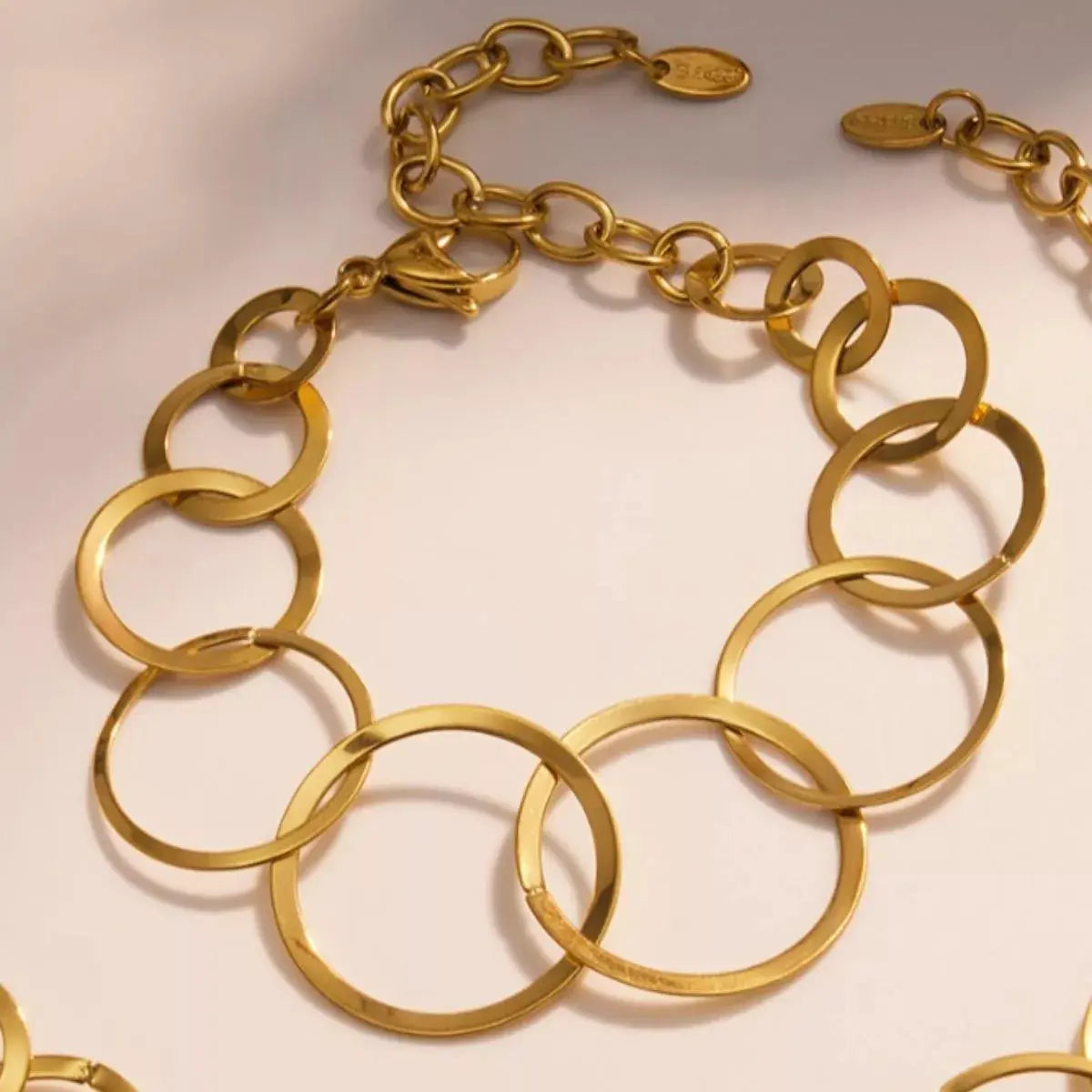 Woman wearing gold titanium steel round bracelet