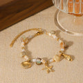 18K gold-plated shell charm bracelet from Vicsxox