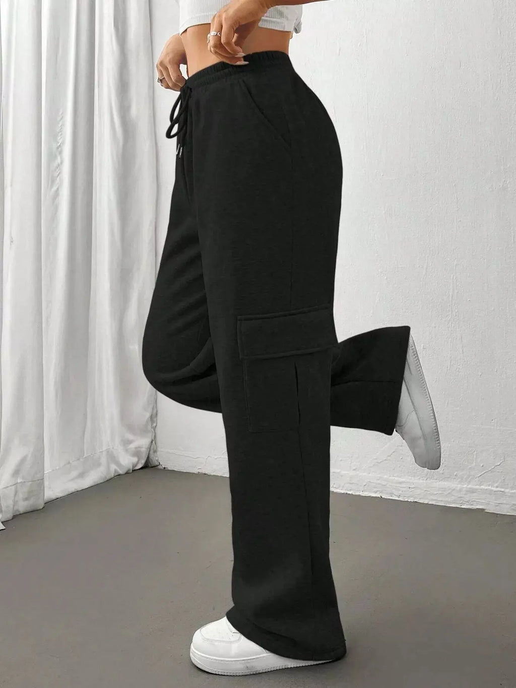 Relaxed fit drawstring pants styled on model