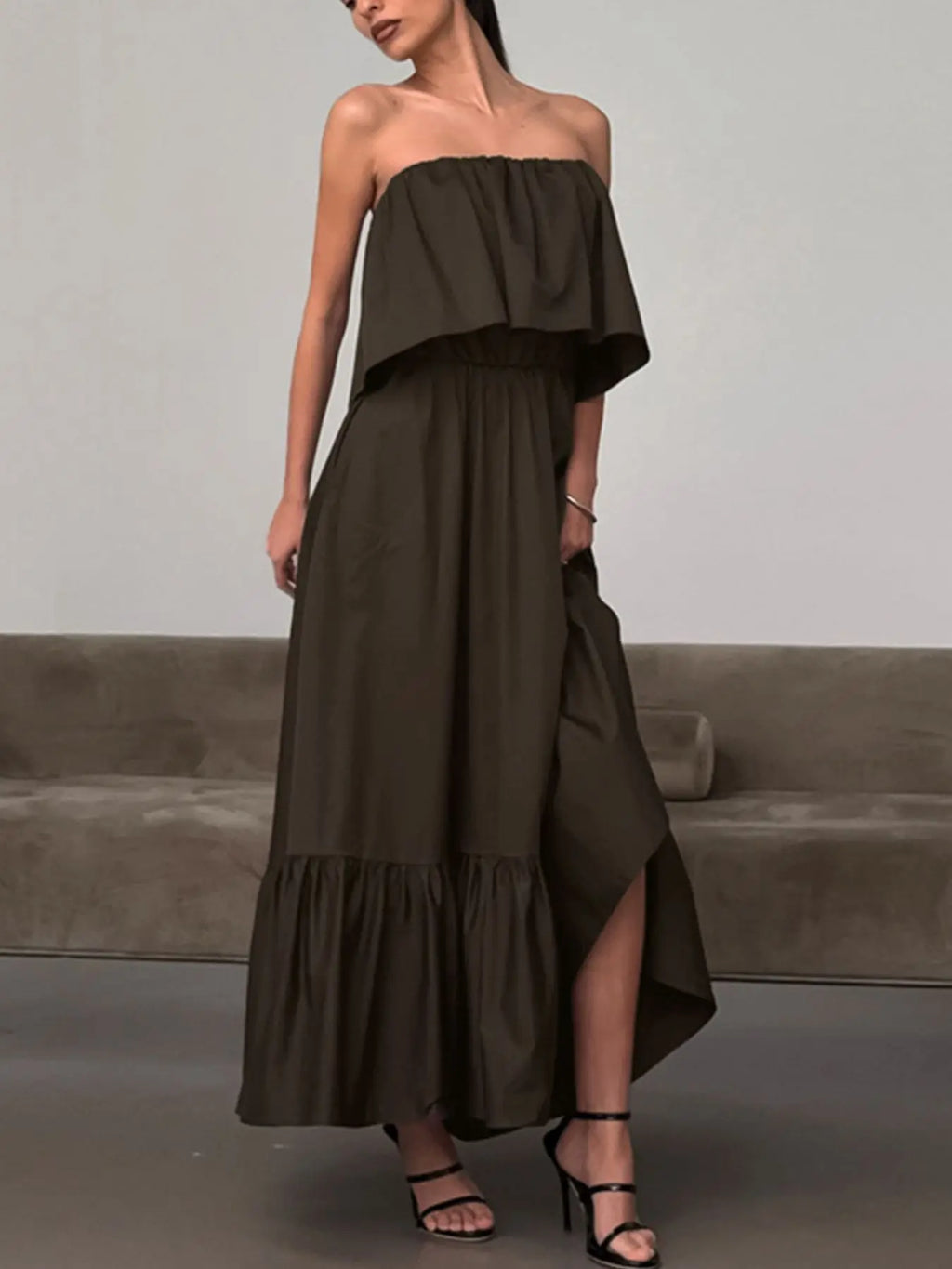Close-up of tiered ruffle hem on off-shoulder maxi dress