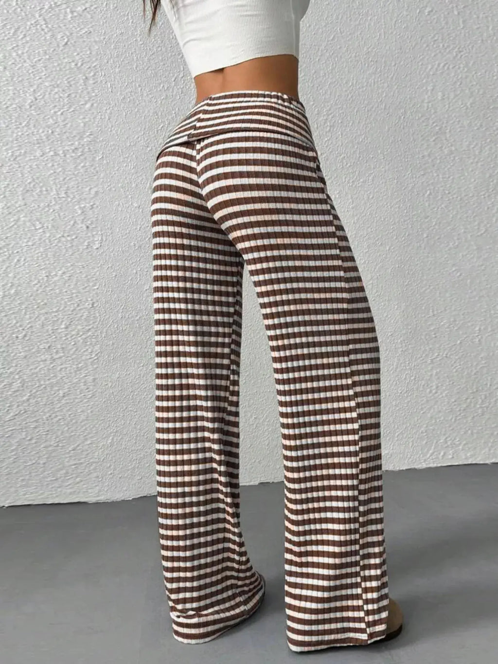 Striped wide leg pants styled on model