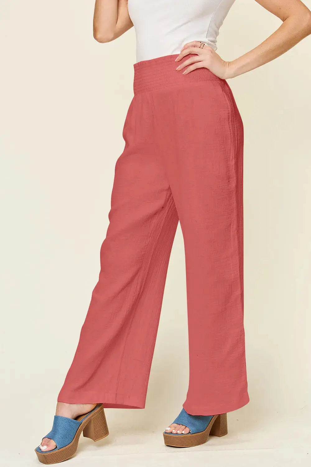 Smocked waist wide leg pants styled on model