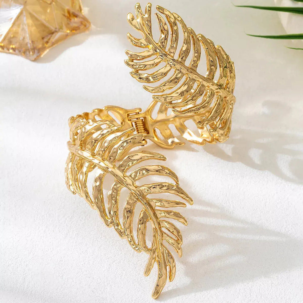 Woman wearing gold leaf bracelet