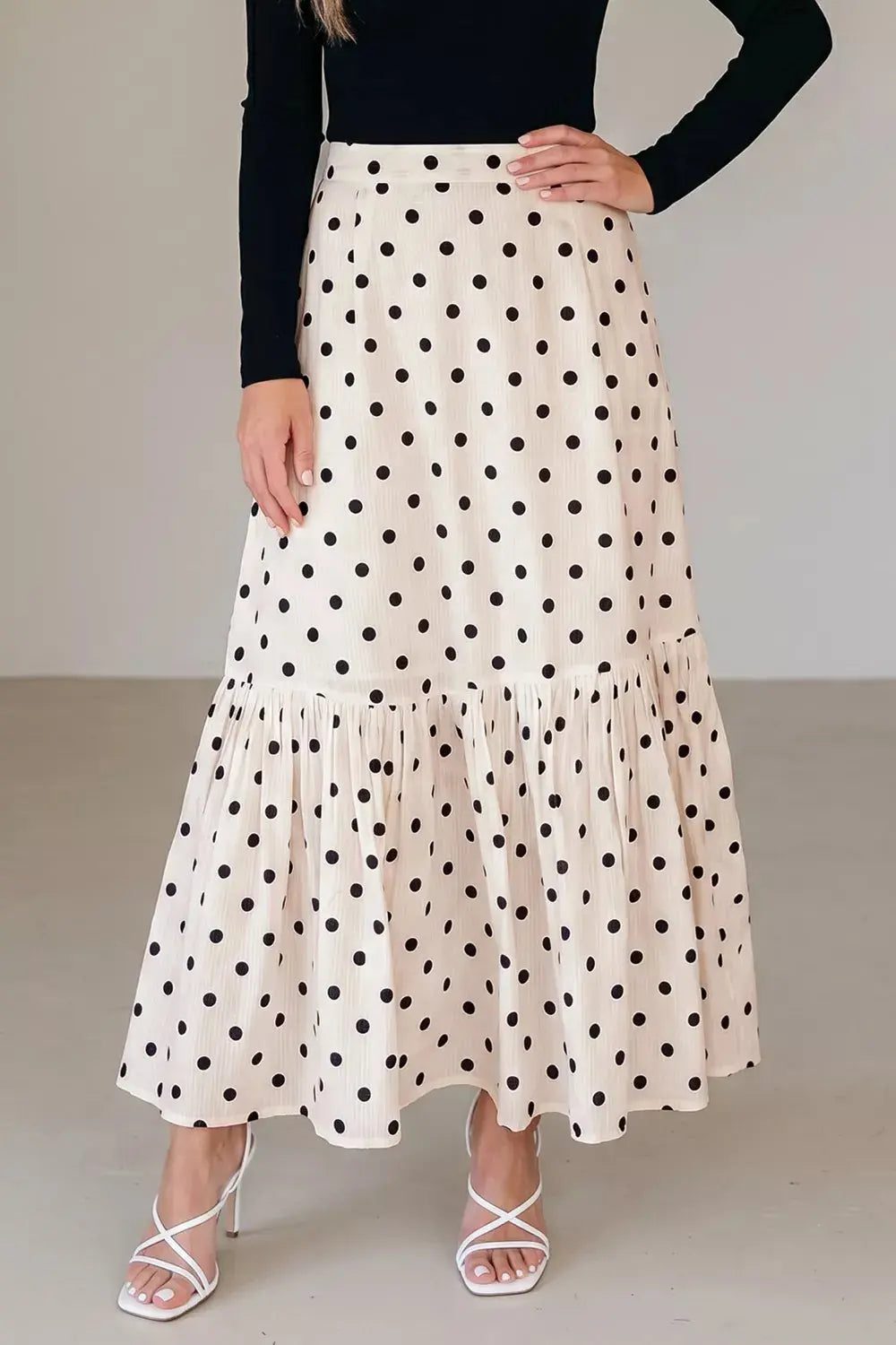 Polka dot ruffled maxi skirt styled on model