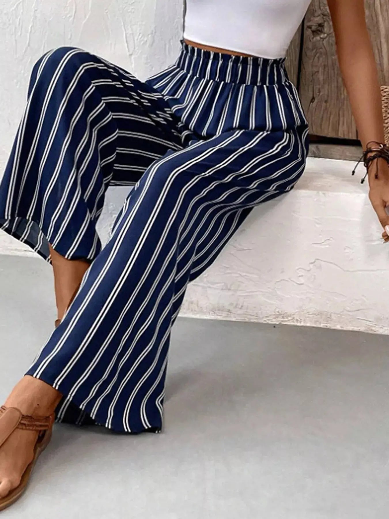 Striped wide-leg pants styled on model
