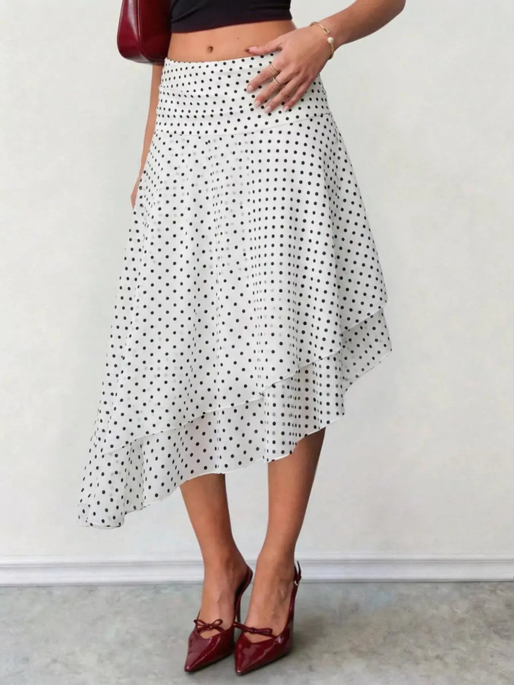 Polka dot asymmetrical midi skirt detail