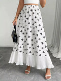 Bow print ruffle hem flowy maxi skirt, front view