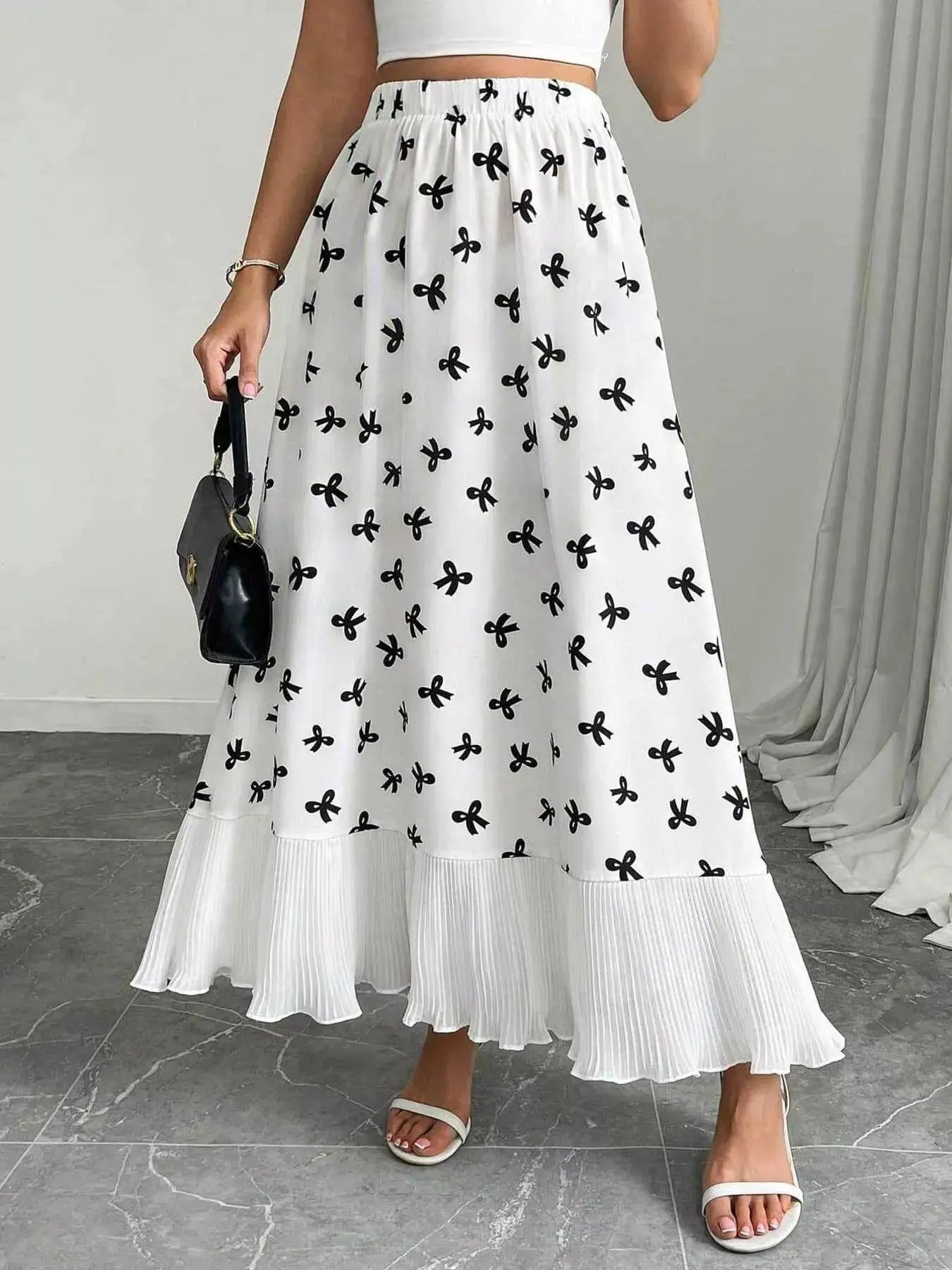 Bow print ruffle hem flowy maxi skirt, front view