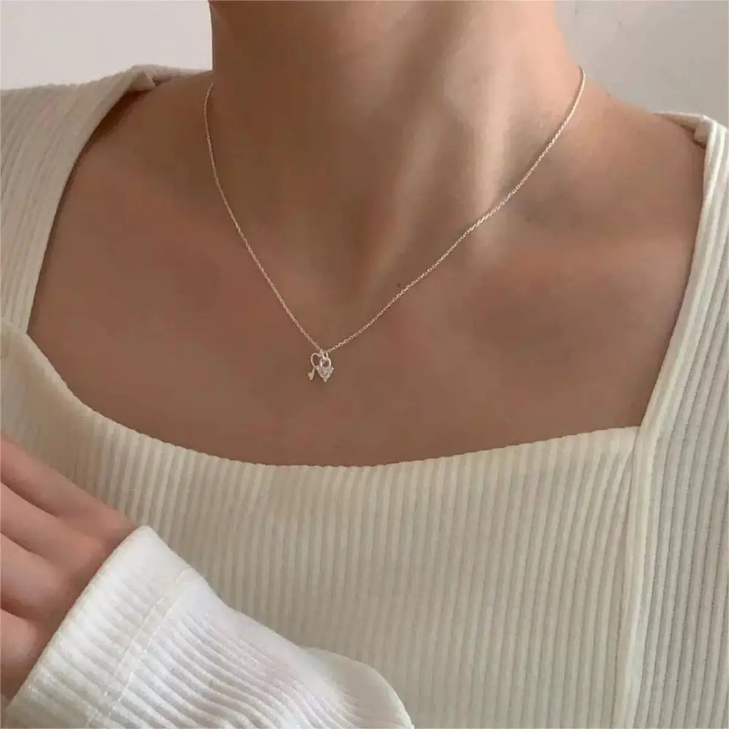 Close-up of heart pendant on silver necklace