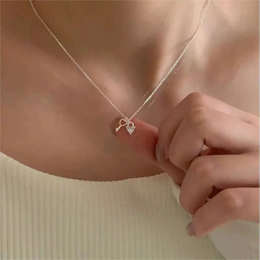 Woman wearing silver heart necklace