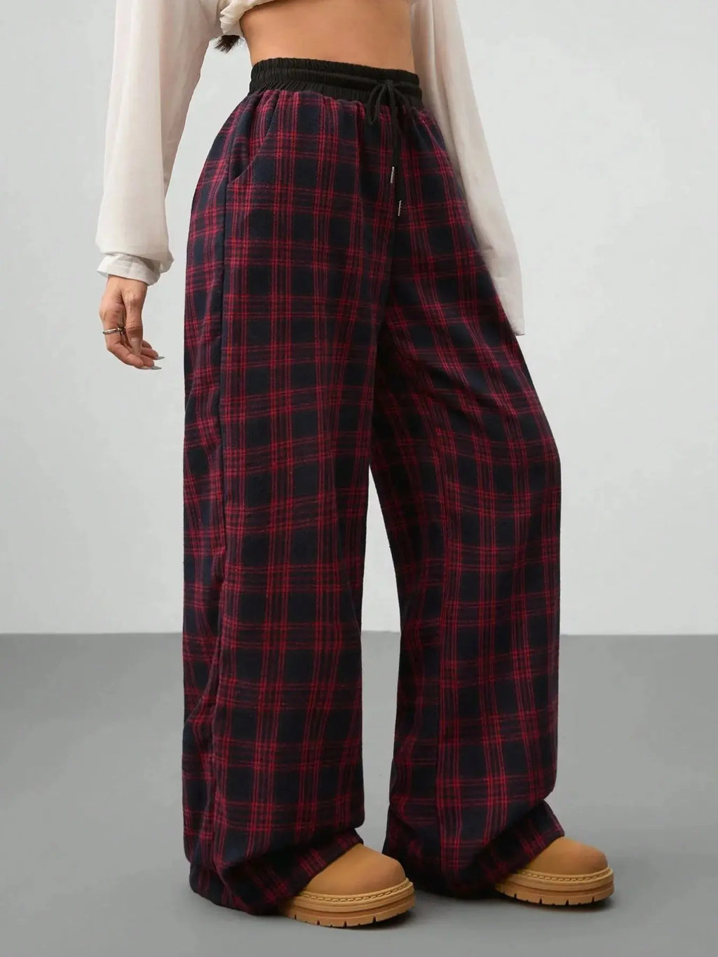 Plaid drawstring wide leg pants styled on model