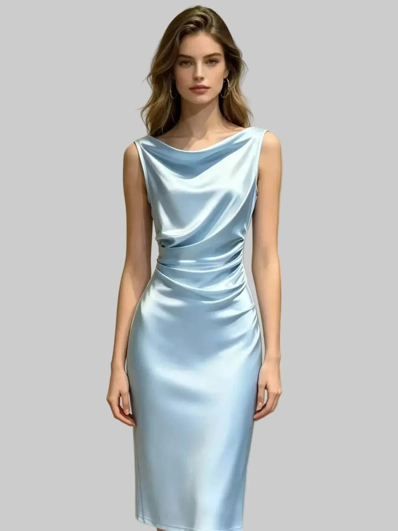 Woman wearing a light blue satin dress against a plain background