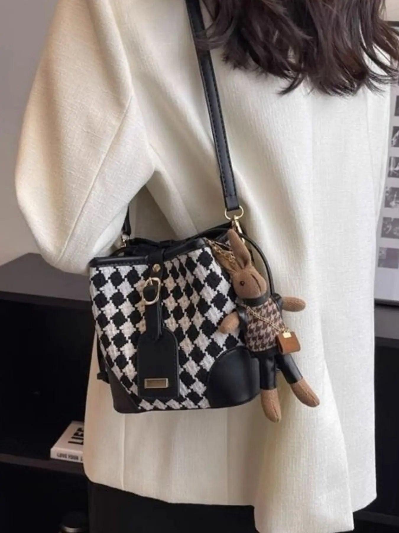 Checkerboard woven bucket crossbody bag styled on model Vicsxox.com